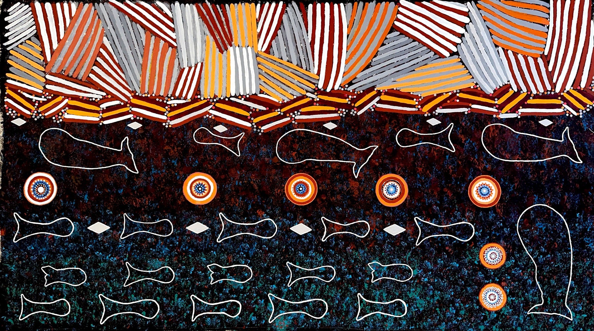 Aboriginal art piece with geometric patterns and whale illustrations on a dark background