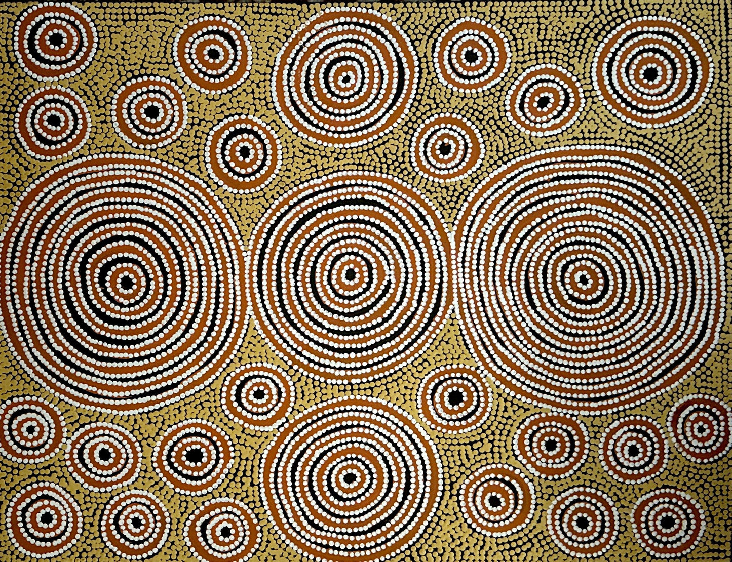  Debra Nangala McDonald Mosaic art with concentric circles in brown, black, and white on a beige background